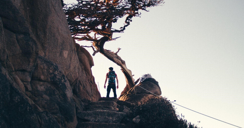 Person with a plan beginning to climb.