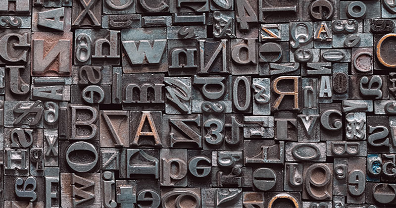 Letterpress letters arranged on a table.