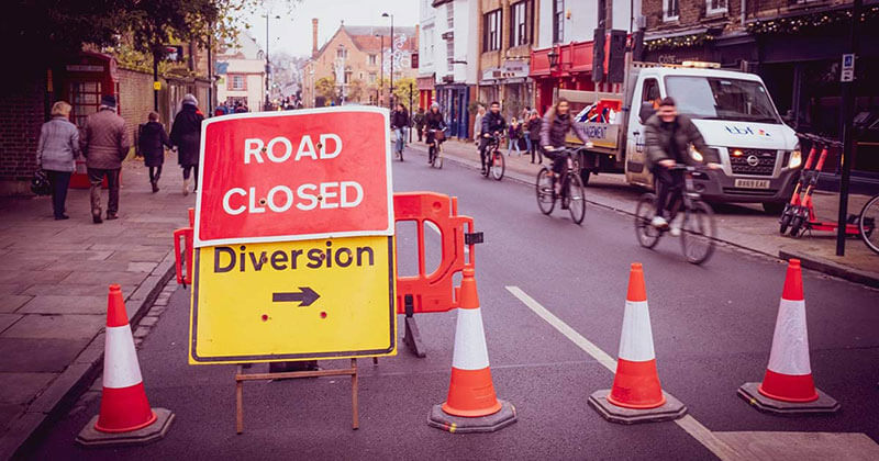 Road closure and signs present travelers with a new situation out of their control.